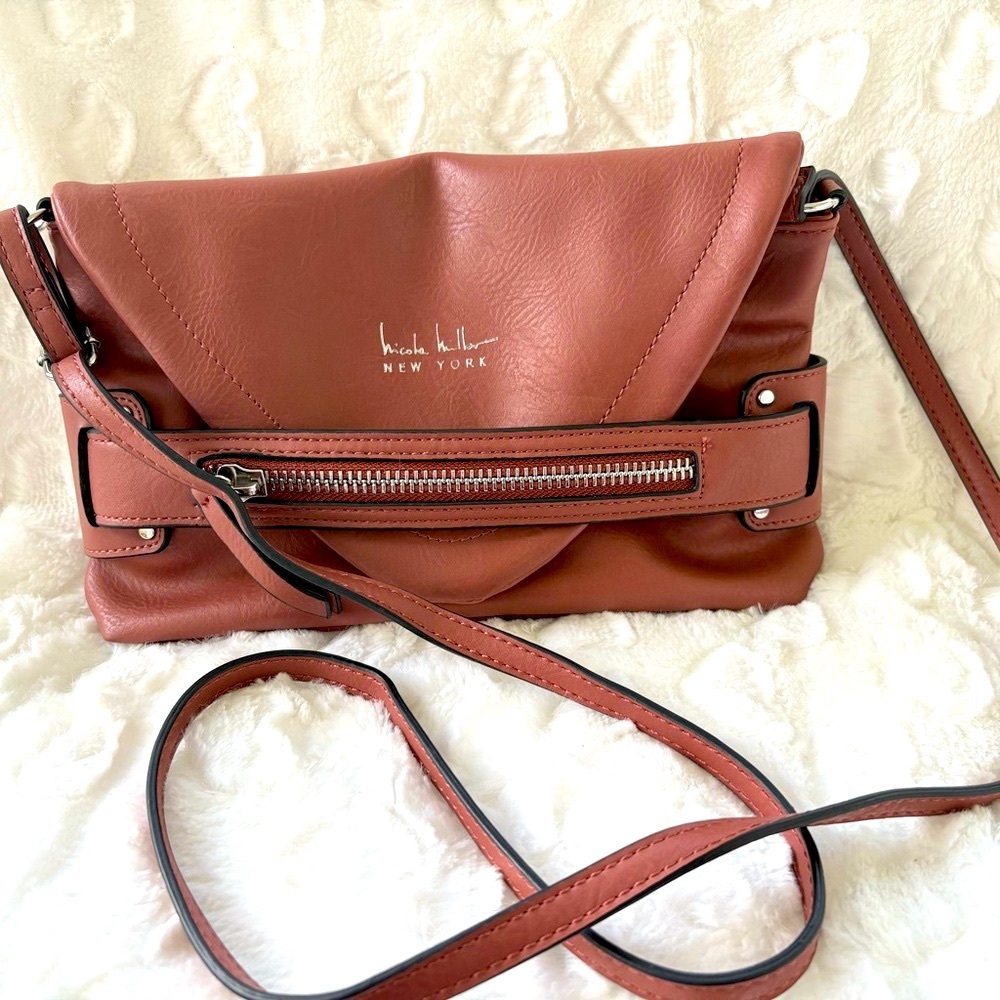 Nicole Miller Handbag Laura Small Crossbody
Brown zipper detail front. Very soft
